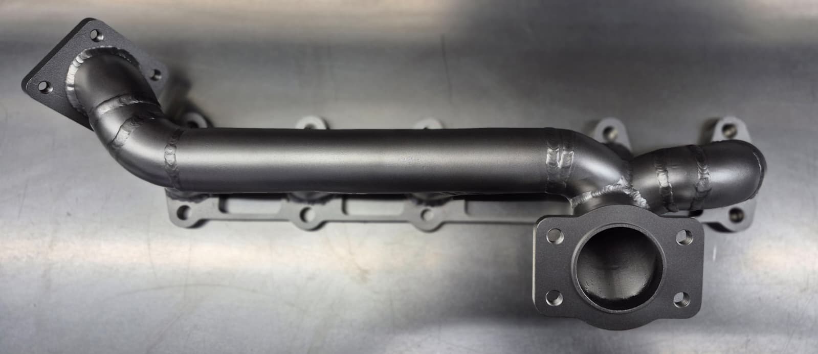 Edelstahl-Rohrkrümmer für Serienposition – Audi Coupe 10VT / Urquattro 10VT / Audi 200 10VT, K24/K26 Flansch / Upgrade